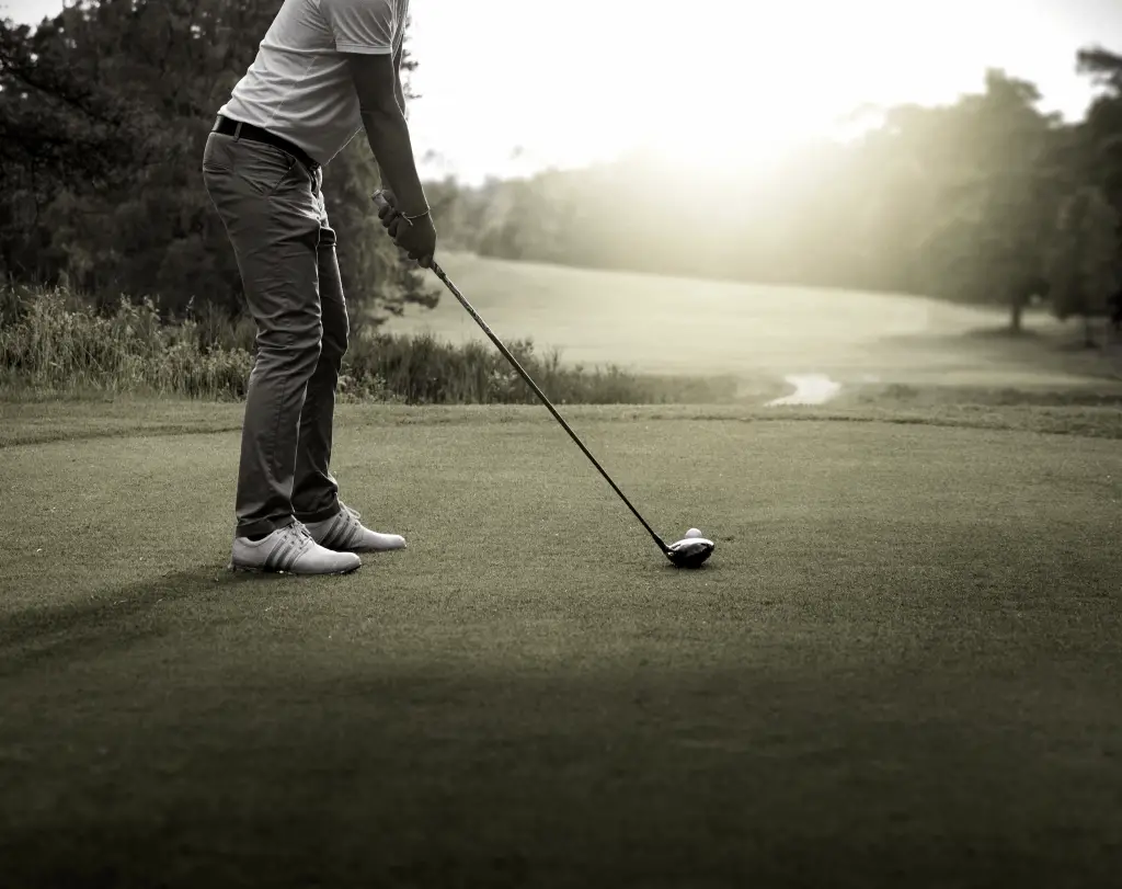 Golfer on tee box holding driver