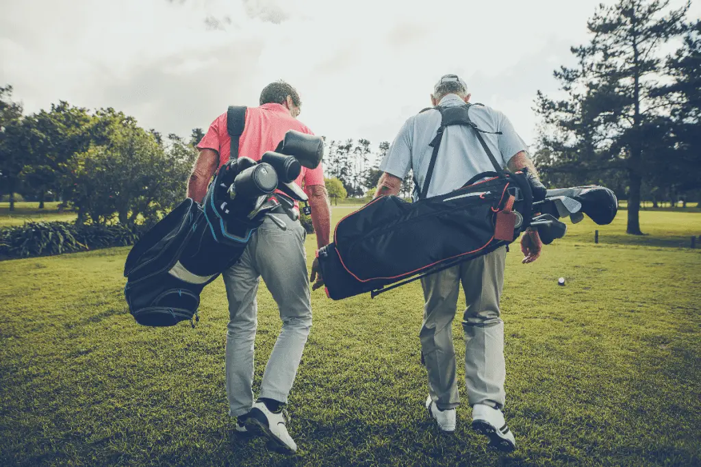 golfers walking up the fairway