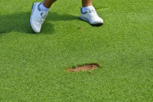 golfer taking a divot