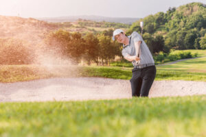 Golfer hitting 56 degree wedge